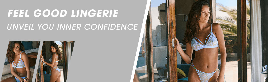 FEEL GOOD LINGERIE – UNVEIL YOUR INNER CONFIDENCE. Frau in weißer Spitzenunterwäsche steht vor einer Glastür und blickt nach draußen.